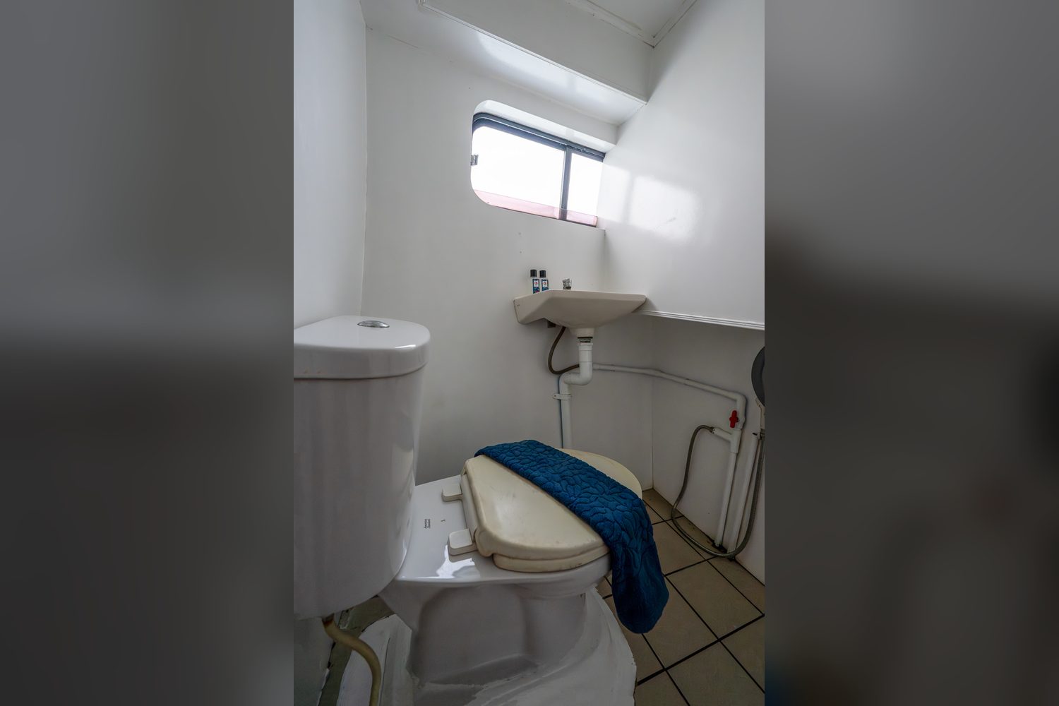 Bathroom shared by two cabins, MV Manta Queen 6