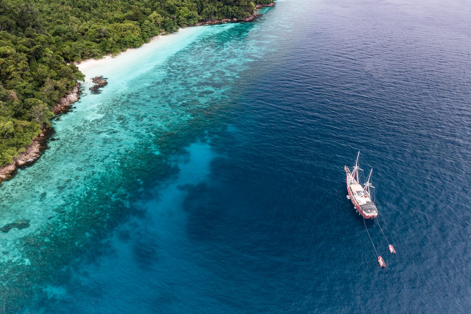 The Phinisi anchored off an island